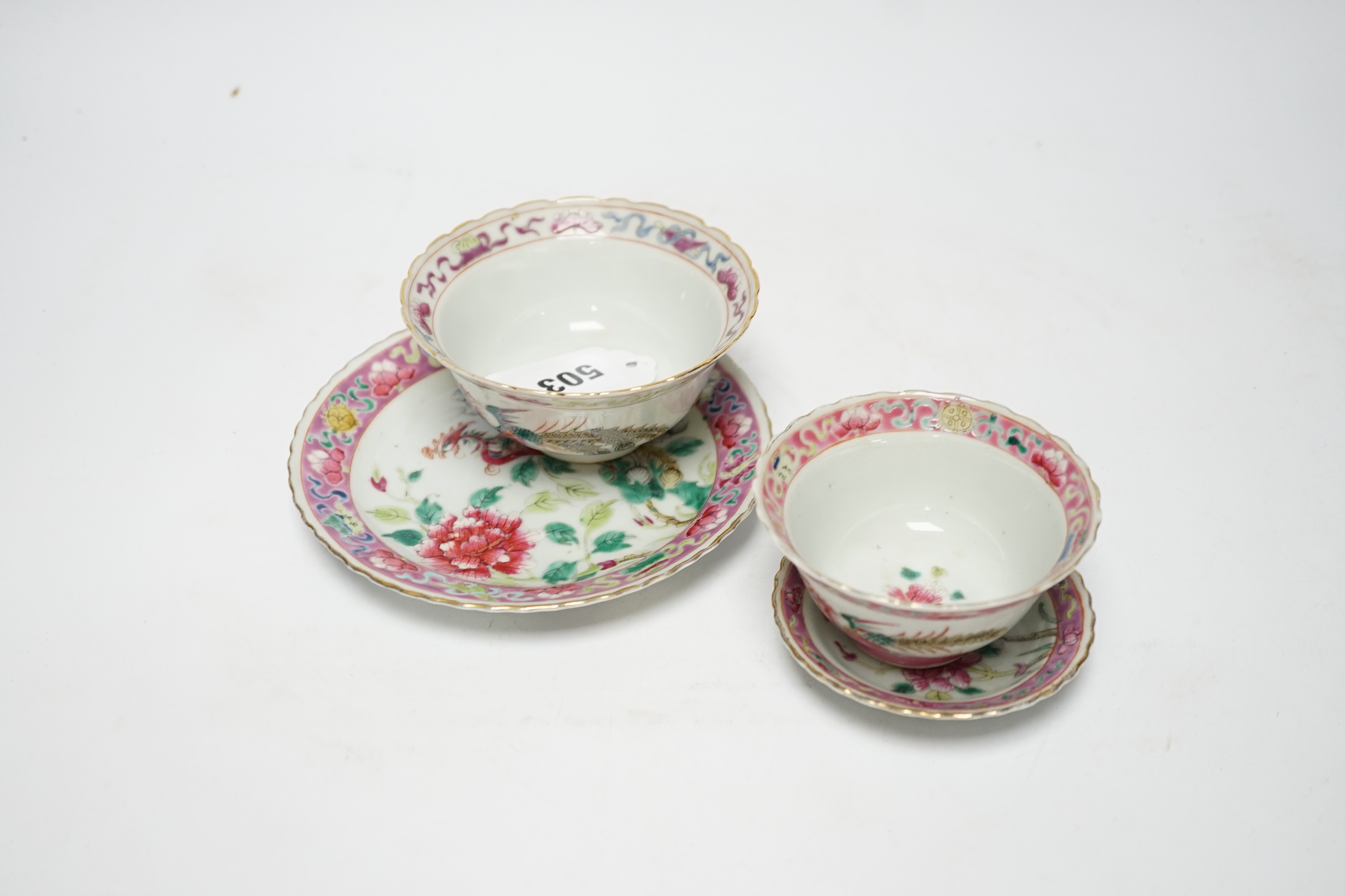 Two Chinese Straits Nonya ware famille rose tea bowls, larger 11cm diameter, and two saucer dishes, Guangxu period